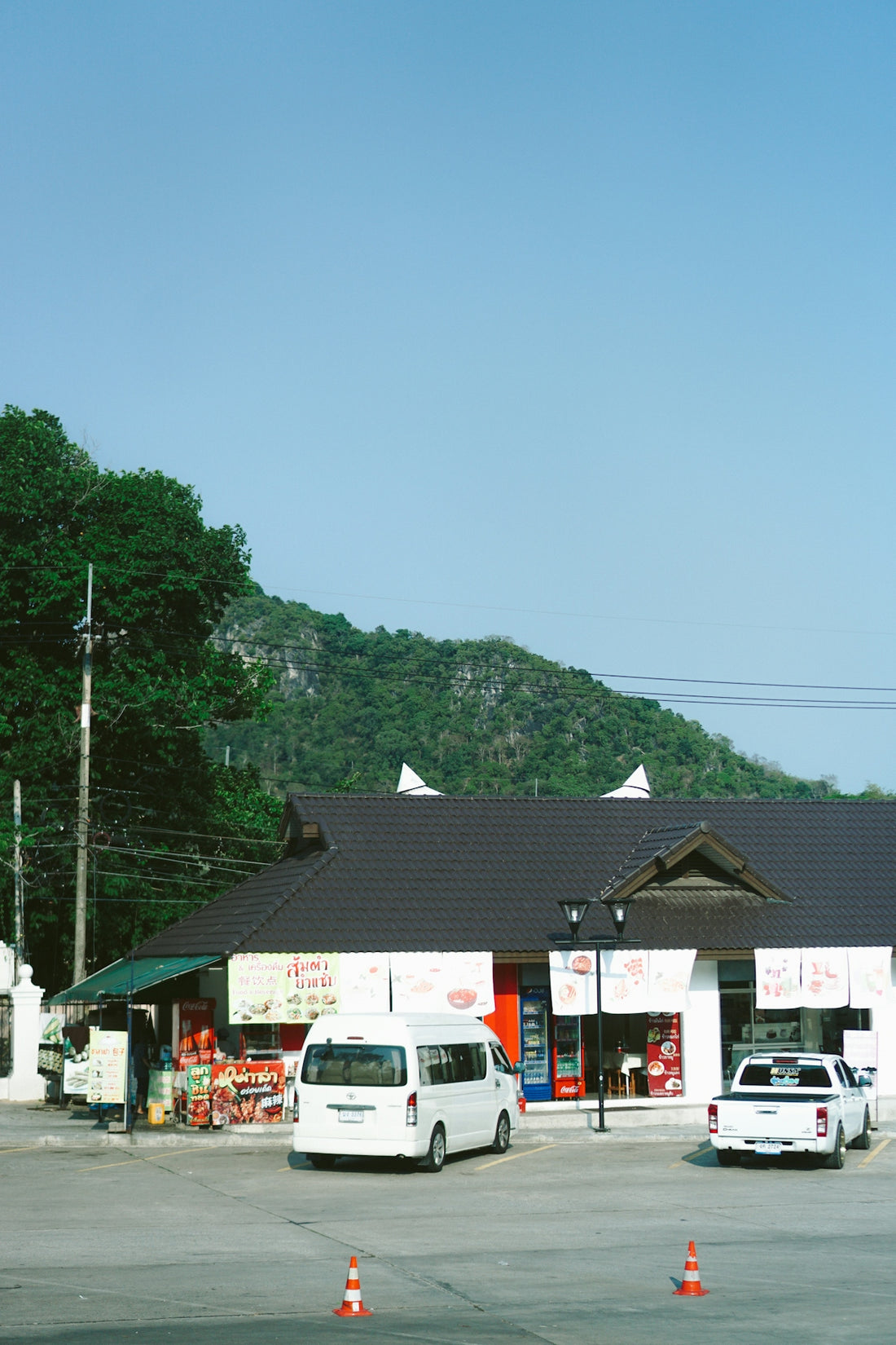 a white van parked in front of a store